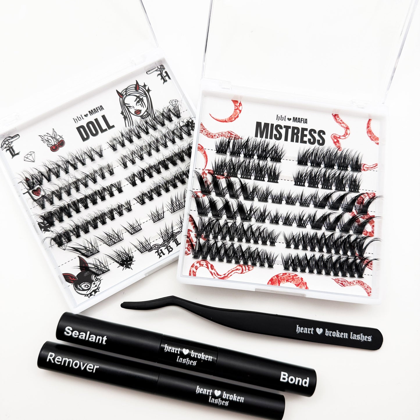 Eyelash extensions with packaging and tools on a white background